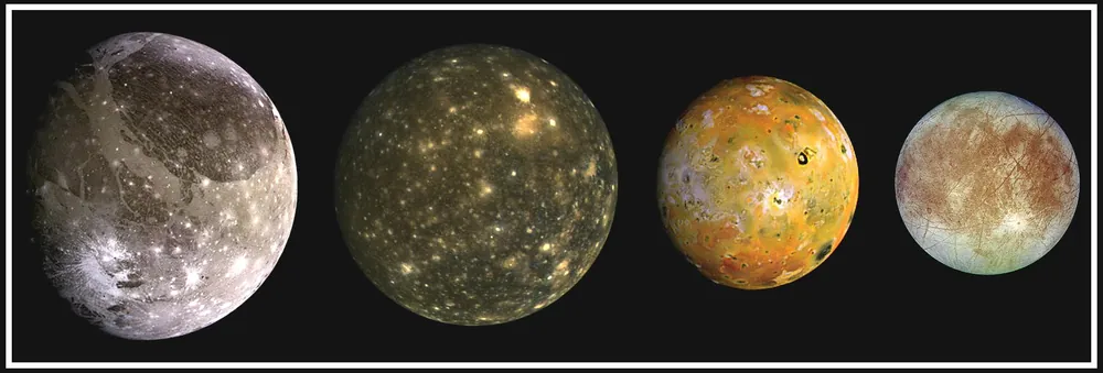 Jupiter's Great Red Spot and the four Galilean moons, from Galileo.