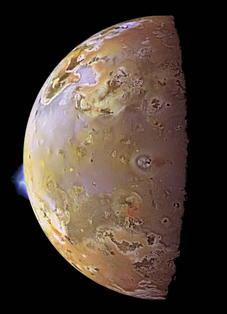 Io with active volcanic plumes on the limb, from Galileo.