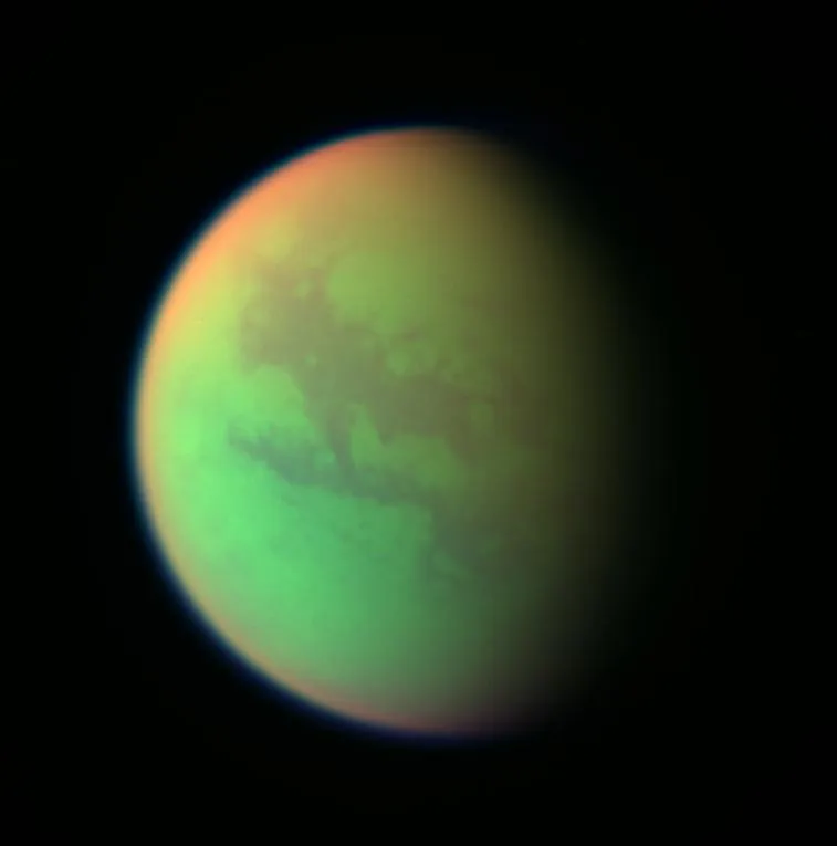 False-color composite of Titan revealing surface detail through the haze.