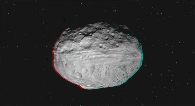 Dawn view soaring over Vesta's cratered surface.